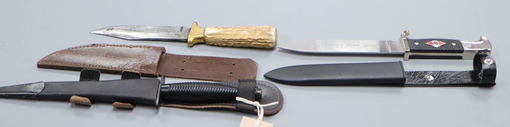 A Fairbairn and Sykes third pattern commando knife, an antler handled knife, blade inscribed Hern, Death or Glory and another knife